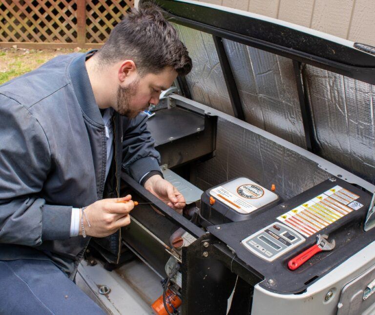 Bruni & Campisi technician servicing HVAC equipment